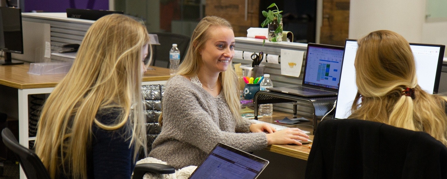 female marketer working at her desk